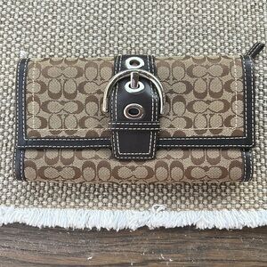 Used trifold coach wallet in good condition.